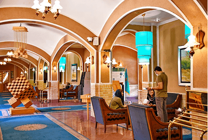 Cozy lounge area with warm lighting and comfortable seating.