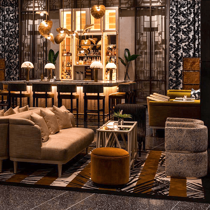 Cozy lounge area with warm lighting and plush seating.